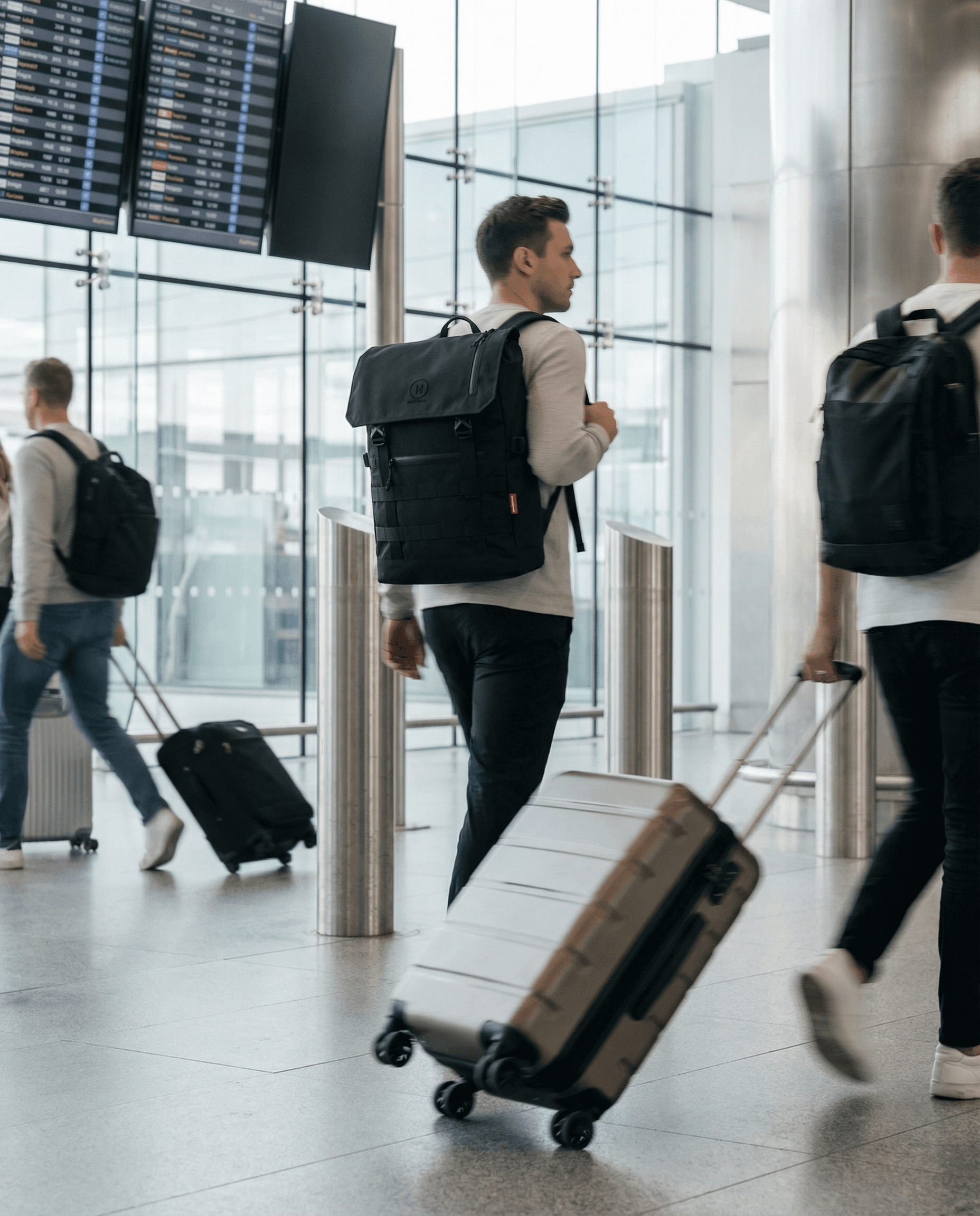 Minato Premium 6.0 – Black Knight backpack at airport, featuring durable design and stylish functionality.