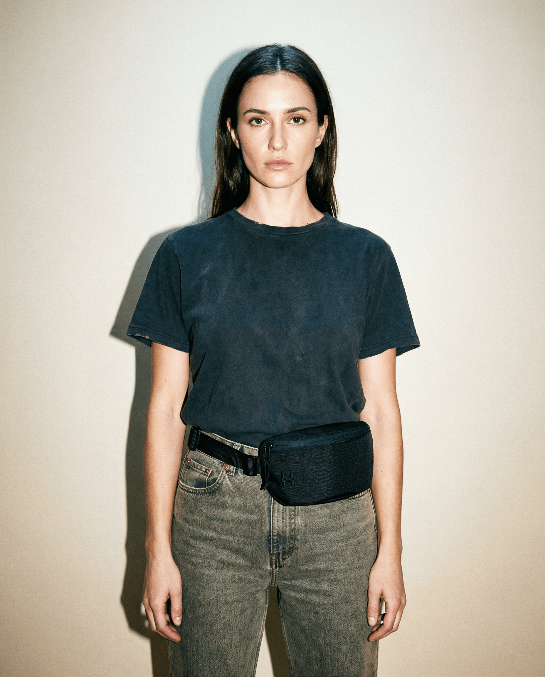 Sora 2.0 - Black Knight worn by model, showcasing its minimalist urban design and practical functionality.