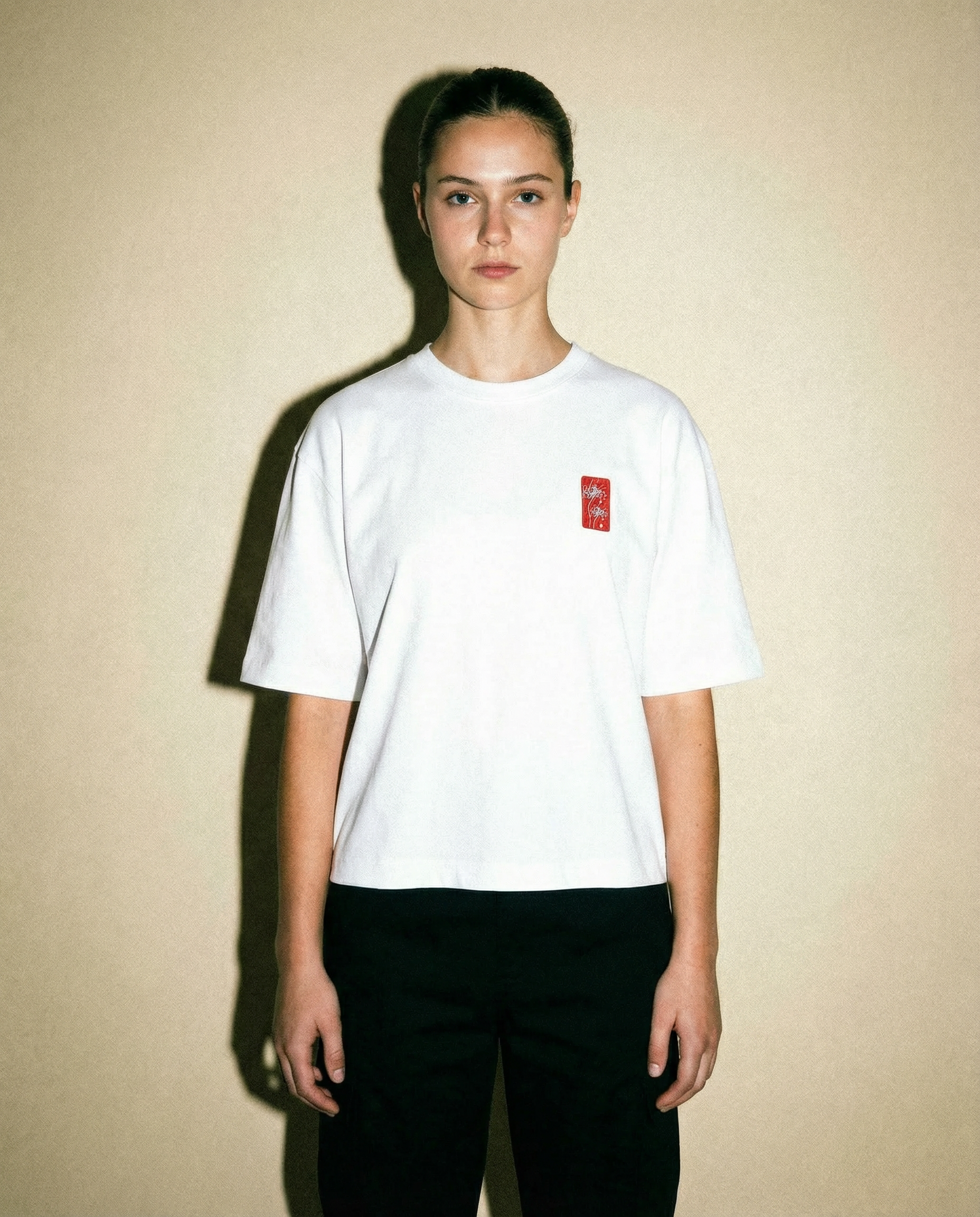 Spider Lily - White Cropped Oversized Tee on model standing against a neutral background.